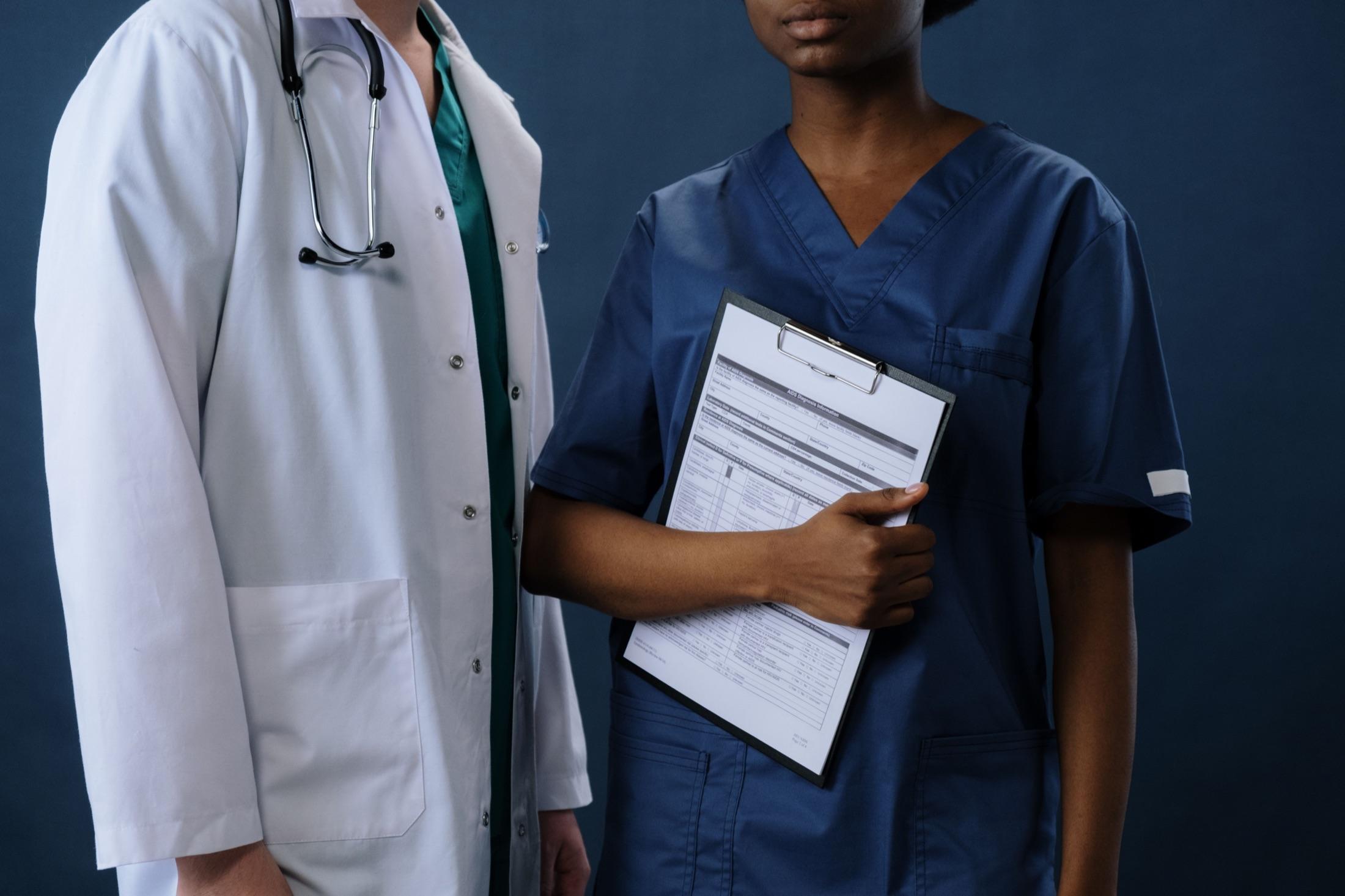 Physician and nurse reviewing a clinical chart